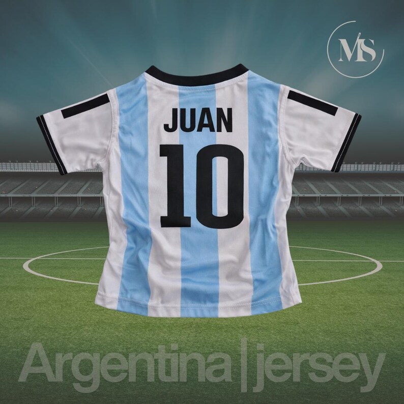May include: Argentina jersey with the name "JUAN" and the number "10" on the back. The jersey has light blue and white vertical stripes, with black accents on the sleeves and collar. The text "Argentina jersey" is at the bottom.