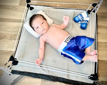 Conjunto completo de sesión de fotos para recién nacidos: bata, pantalones cortos, miniguantes y cuadrilátero de boxeo para el pequeño campeón.