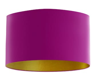 May include: A magenta lampshade with a gold lining.