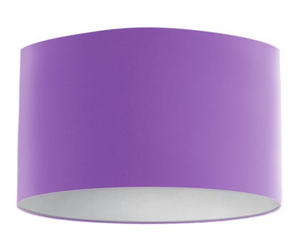 May include: A purple lampshade with a white lining. The lampshade is cylindrical in shape.
