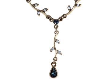 Black Lariat Necklace 1928 Jewelry Company Japanned Metal Light and London Blue Rhinestone Accent