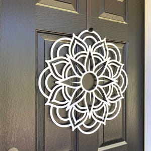 Left Angle View - Metal Geometric Mandala Door Wreath shown in Satin Silver on Black Front Door