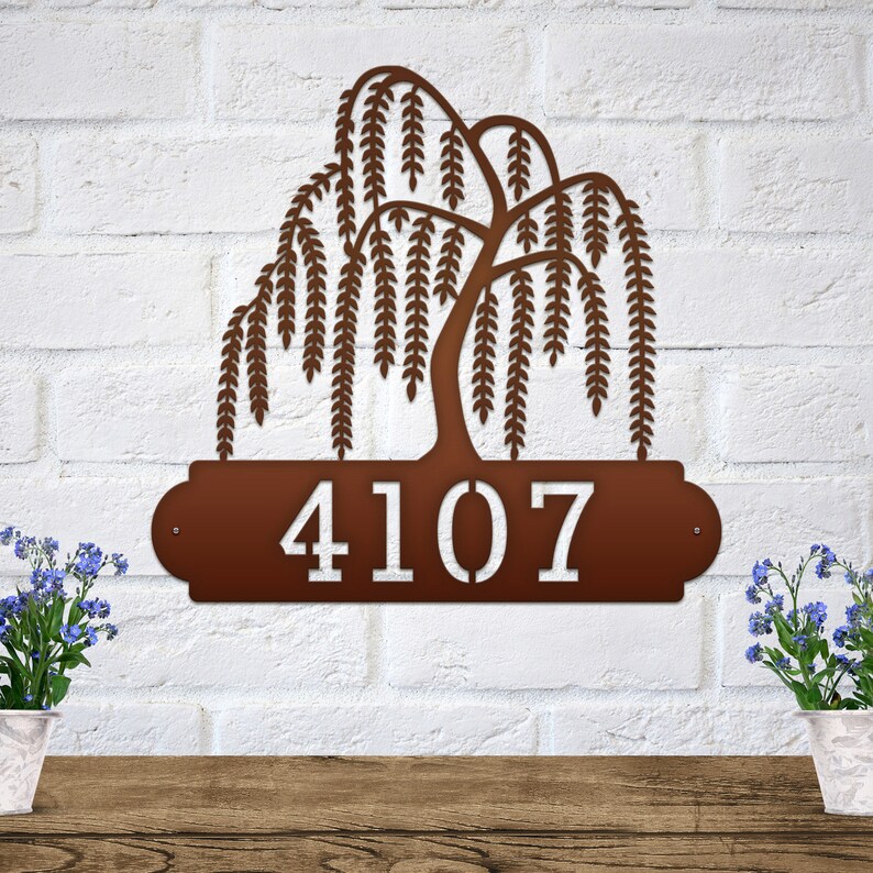 Weeping Willow House Numbers Plaque shown in Candy Copper with Example Street Numbers on White Brick Wall