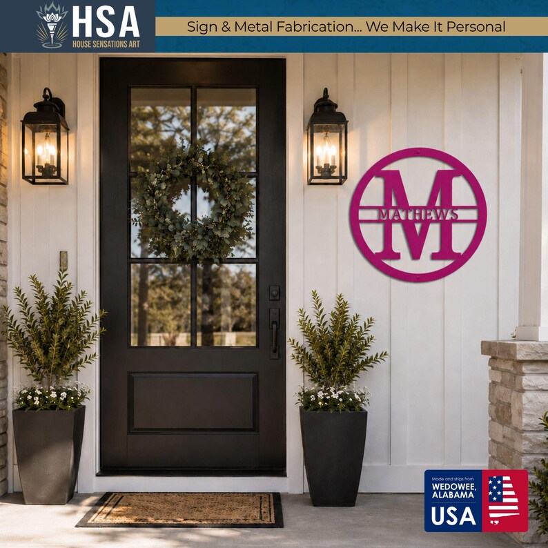 Personalized monogram family name sign in magenta, circular monogram wall art beside a black front door with wreath.