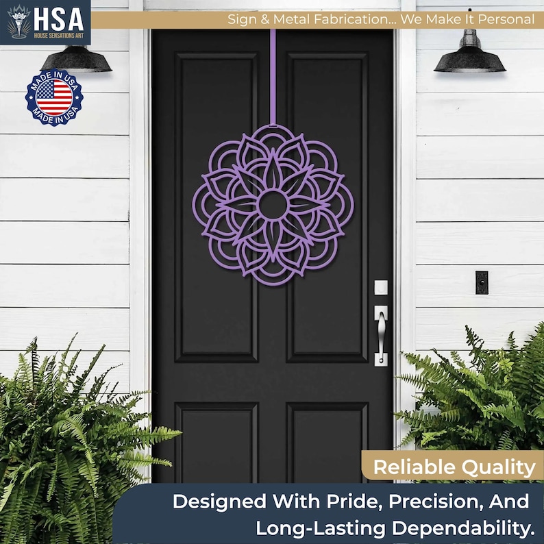 Purple metal mandala door wreath hanging on a black front door; geometric garden art for year-round front door decor.