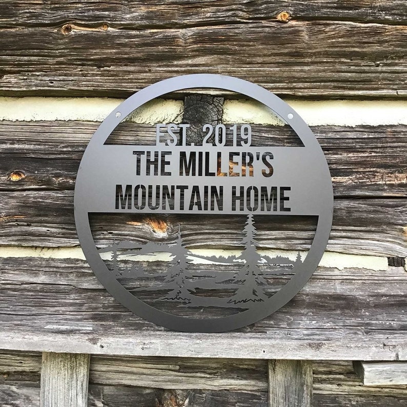 Front Angle - Mountain Homestead Personalized Last Name Sign shown on dark wood background