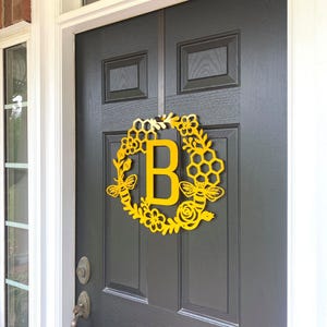 Right Angle View - Monogram Honey Comb Honey Bee Floral Wreath with monogram letter "B" in Golden Yellow on black front door