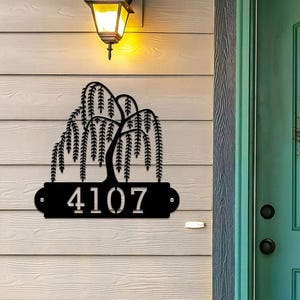 Weeping Willow House Numbers Plaque shown in Black with Example Street Numbers on Exterior House Wall