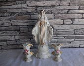 Vintage porcelain statue of Virgin Mary and a pair of spill vases or candle holders