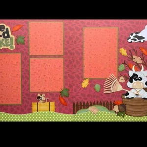 May include: A scrapbook page with a pink background and four photo frames. The page features a cow with a rake, a cloud, and the text "In the moo-d to rake!"