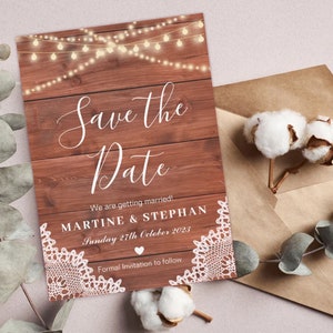 May include: Rustic save the date card with a woodgrain background and fairy lights. The text reads "Save the Date" with the couple's names, "Martine & Stephan", and the date "Sunday 27th October 2023".