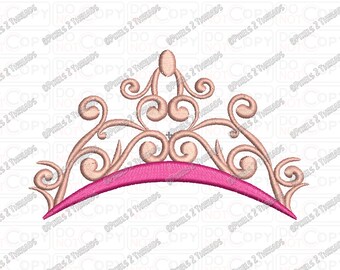 May include: A pink and gold tiara with a delicate, ornate design. The tiara has a curved shape and is decorated with swirls and scrolls.