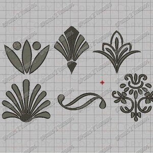 May include: Eight different decorative designs in a gray color. The designs are stylized and include a flower, a fan, a swirl, and a damask pattern.