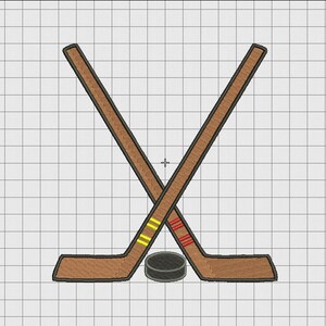 May include: Two crossed brown hockey sticks with yellow and red tape, and a black puck.