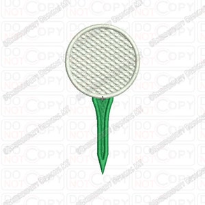 May include: A white golf ball with dimples on a green golf tee.