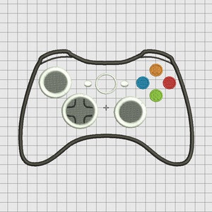 May include: A black and white gamepad with four buttons, a directional pad, and two analogue sticks. The buttons are coloured red, orange, green, and blue.