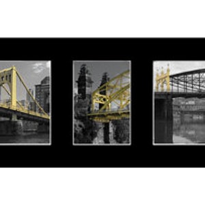 May include: A triptych artwork featuring three framed images of bridges. The bridges are painted yellow, set against a black and white background. The artwork is displayed on a black background.