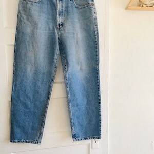 Vintage 90’s Levis, Vintage Levis jeans, Levis 550, 34”, made in USA, ultra high rise, red tab, kinfolk, vintage 90’s jeans, free people,