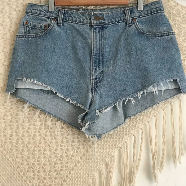 Waist 33"-34" vintage Levis cutoffs, high rise jeans, jean cutoffs, jean shorts, festival fashion, free people like, hippie shorts, bohemian