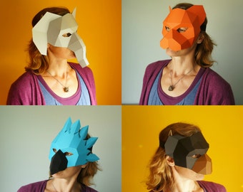 May include: Four people wearing paper masks. The masks are a white elephant, a red fox, a blue bird, and a brown dog. The people are wearing purple, pink, and blue shirts.