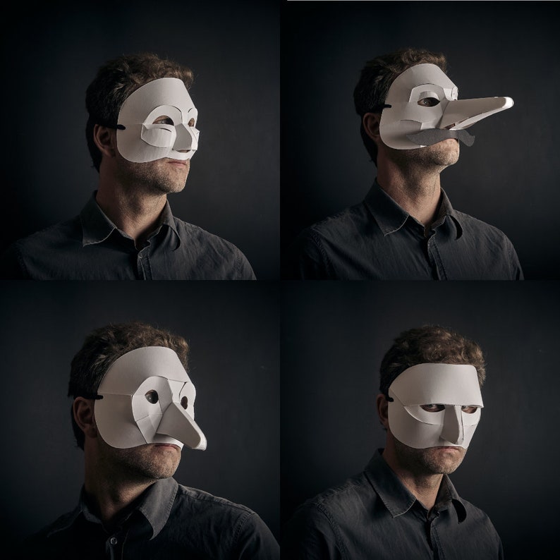 May include: Four people wearing different white paper masks. The masks are all unique and have different shapes and sizes. The people are all looking at the camera.