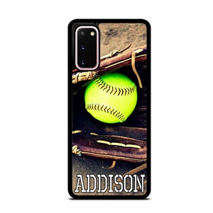 May include: A black phone case with a softball and glove design. The softball is yellow and green and the glove is brown. The text "ADDISON" is printed on the case.