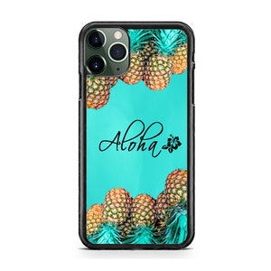 May include: A black iPhone case with a turquoise background and a pattern of pineapples. The text "Aloha" is written in black cursive with a small black hibiscus flower to the right of the text.