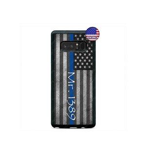 May include: A black phone case featuring a distressed American flag design with a blue stripe. The case has the text "Mr. 1389" in white vertical lettering. A small "US Seller" sticker is in the upper right corner.