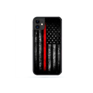 May include: Black iPhone case with a distressed American flag design and a red stripe down the center.