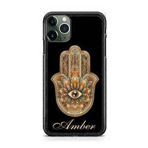 May include: A black phone case with a gold hamsa hand design and the name "Amber" printed in gold script.