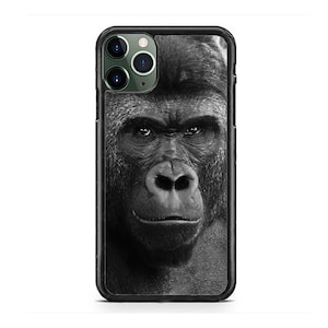 May include: Black and white phone case featuring a close-up of a gorilla's face.