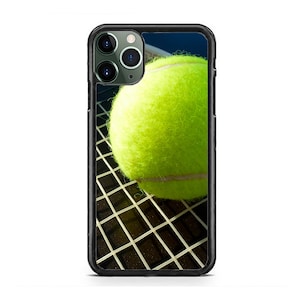 May include: A black phone case with a tennis ball and racket printed on it.