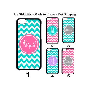 May include: Five different phone cases with a chevron pattern in turquoise and pink. The cases have a circle in the center with a monogram or name in white. The cases are numbered 1 through 5.