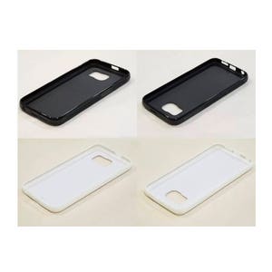 May include: Four phone cases are displayed. Two are black, and two are white. Each case has a rectangular shape with rounded corners and cutouts for the camera and other phone features. The cases appear to be made of a hard plastic material.