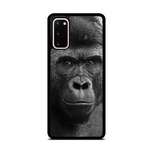 以下が含まれることがあります： ゴリラの顔のクローズアップが特徴の白黒の携帯電話ケース
