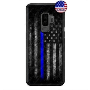 May include: Black phone case featuring a distressed American flag design with a blue stripe. The case has a textured appearance and a camera cutout. A small sticker with the US flag and "US SELLER" is in the upper right corner.