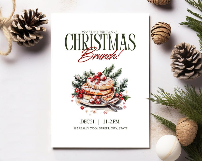 May include: A white invitation card with the text "YOU'RE INVITED TO OUR CHRISTMAS Brunch!" in green and red. The card features a watercolor illustration of pancakes with berries and greenery. The date and time are also included.