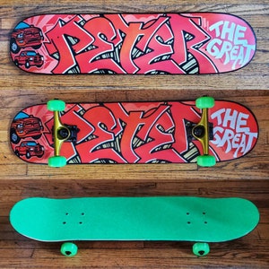 "Peter" custom painted graffiti skateboard (full build) painted and built by Orikal Uno of Graff Roots Media - custom griptape and wheels to match customer's request.