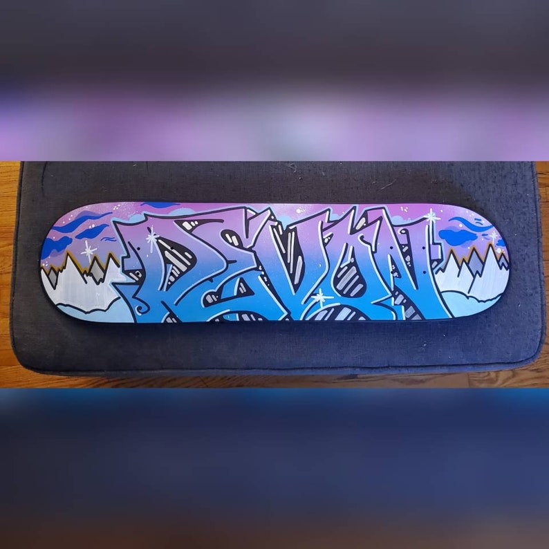 "Devon" custom painted graffiti skateboard painted by Orikal Uno of Graff Roots Media