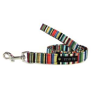 May include: A colourful striped dog lead with a silver clip and the text "Ditsy Pet."