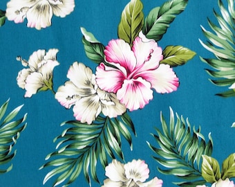 May include: A teal blue fabric with a tropical print featuring white and pink hibiscus flowers and green leaves.