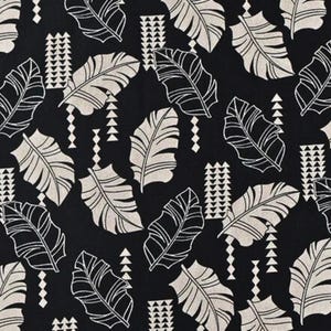 May include: Black and white fabric with a repeating pattern of stylized leaves and geometric shapes.