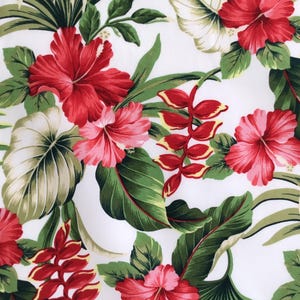 May include: White fabric with a vibrant floral pattern featuring large red and pink hibiscus flowers, red and yellow tropical flowers, and green leaves. The design is a tropical, botanical print.