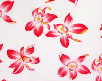 May include: White fabric with a repeating pattern of red and yellow orchid flowers.