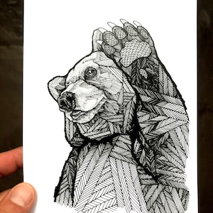 May include: Black and white line art illustration of a bear with its paw raised to its head. The bear is drawn in a detailed, intricate style, with a pattern of lines and shapes covering its entire body.
