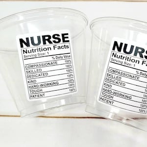 May include: Two clear plastic cups with black and white labels that read "NURSE Nutrition Facts" with a list of qualities and a 100% daily value for each.