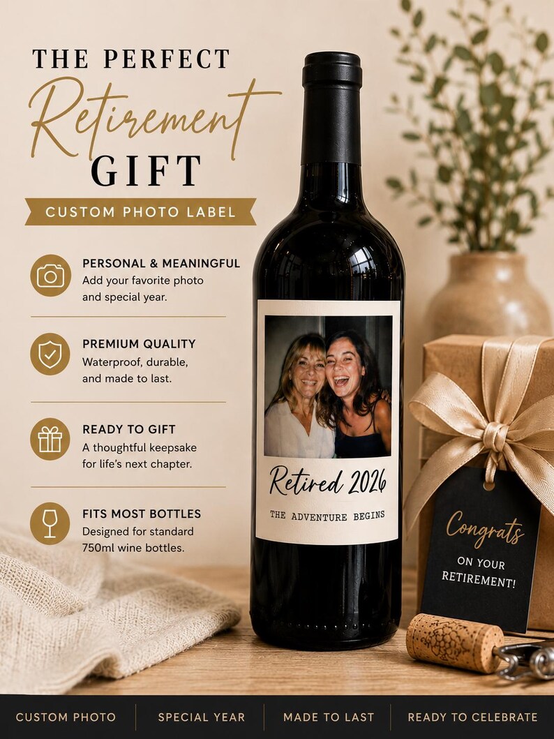 May include: A dark glass wine bottle with a custom rectangular label featuring a photograph of two people, the text Retired 2026, and the phrase THE ADVENTURE BEGINS. The label also lists features including custom photo, special year, and 750ml size.