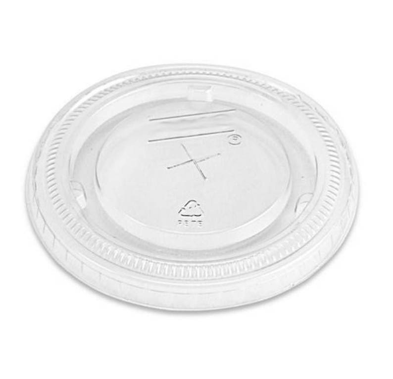 May include: Clear plastic lid for a disposable cup. The lid has a raised lip around the edge and a small, clear dome in the center. The lid is marked with a recycling symbol.
