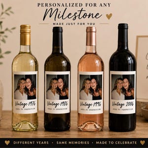May include: Four glass wine bottles with custom labels featuring a photograph of two people and the text Vintage 1976, 1986, 1996, and 2006, with the phrase AGED TO PERFECTION. The bottles have gold, black, rose gold, and black caps respectively.