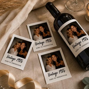 May include: A dark glass wine bottle and three square photo prints featuring two smiling individuals. Each print and the bottle label display the text Vintage 1986 and Aged to Perfection in a black script and serif font combination.